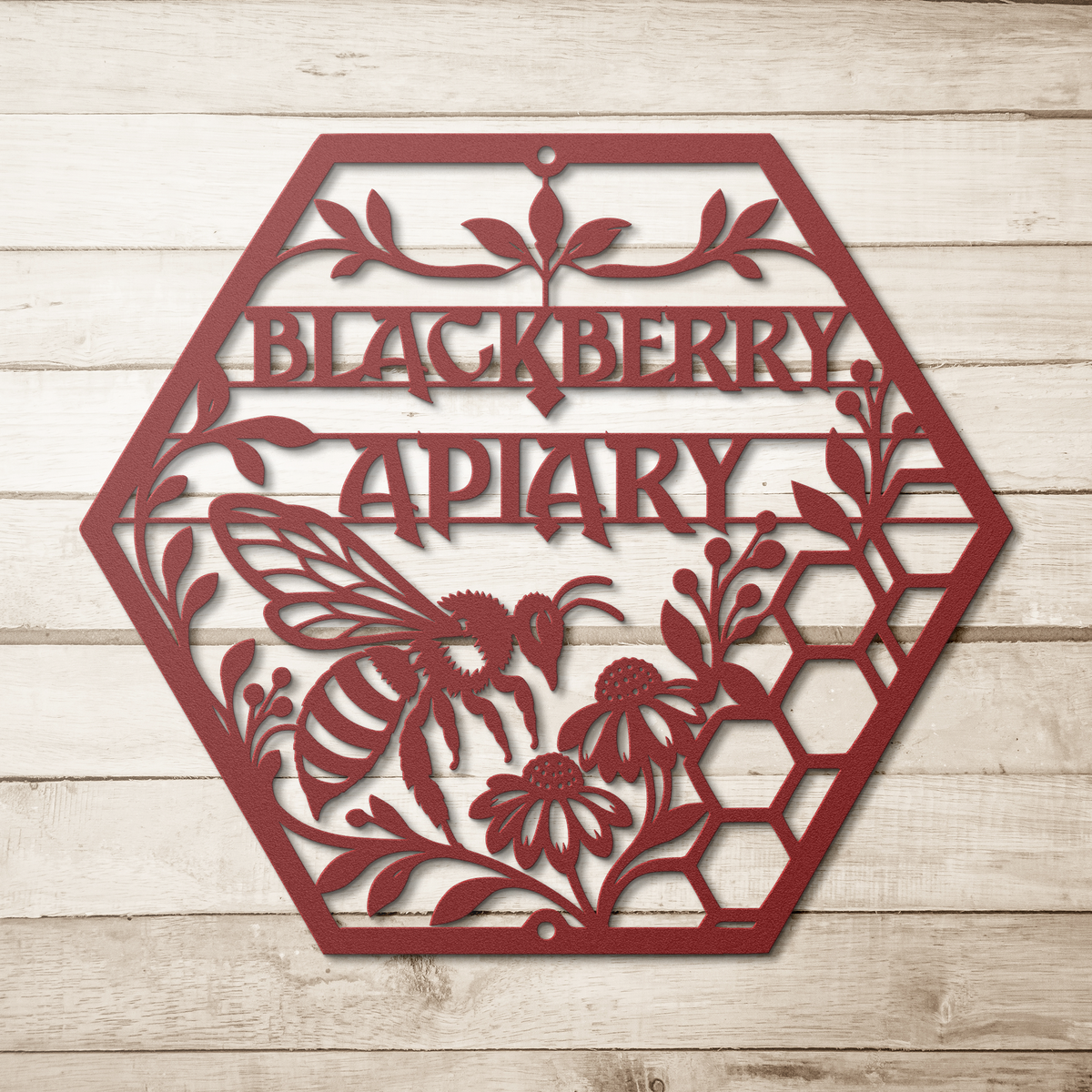 Red custom apiary bee honeycomb metal sign on a wood background — personalized beekeeper wall decor