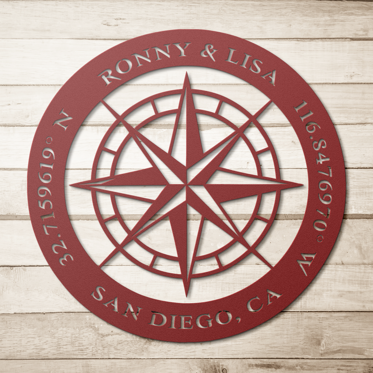 Red custom couples compass coordinates metal sign on a wood background — personalized couples keepsake wall decor