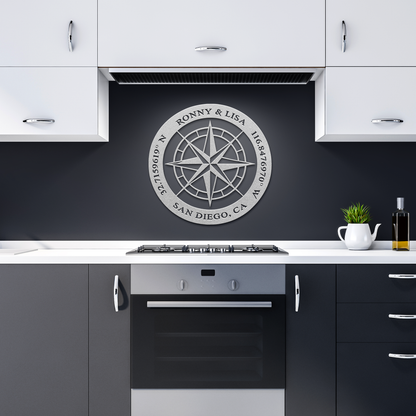 Silver custom couples compass coordinates metal sign in a dark kitchen — personalized couples keepsake wall decor