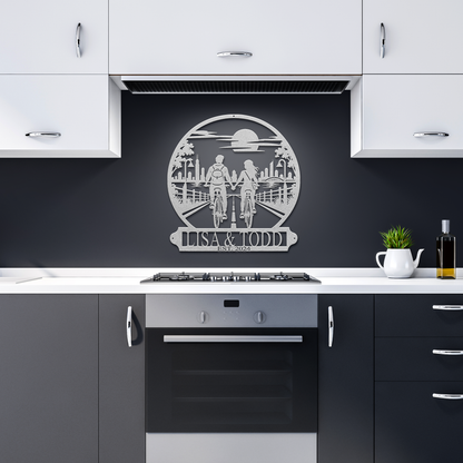 Silver custom cycling couple metal sign in a dark kitchen — personalized couples decor