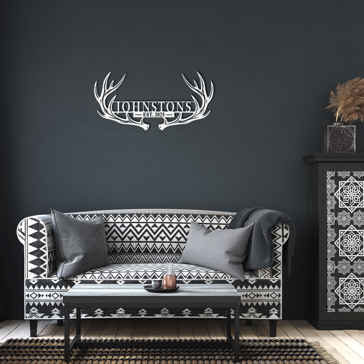 White custom deer antler family name metal sign in a living room — personalized rustic cabin wall decor