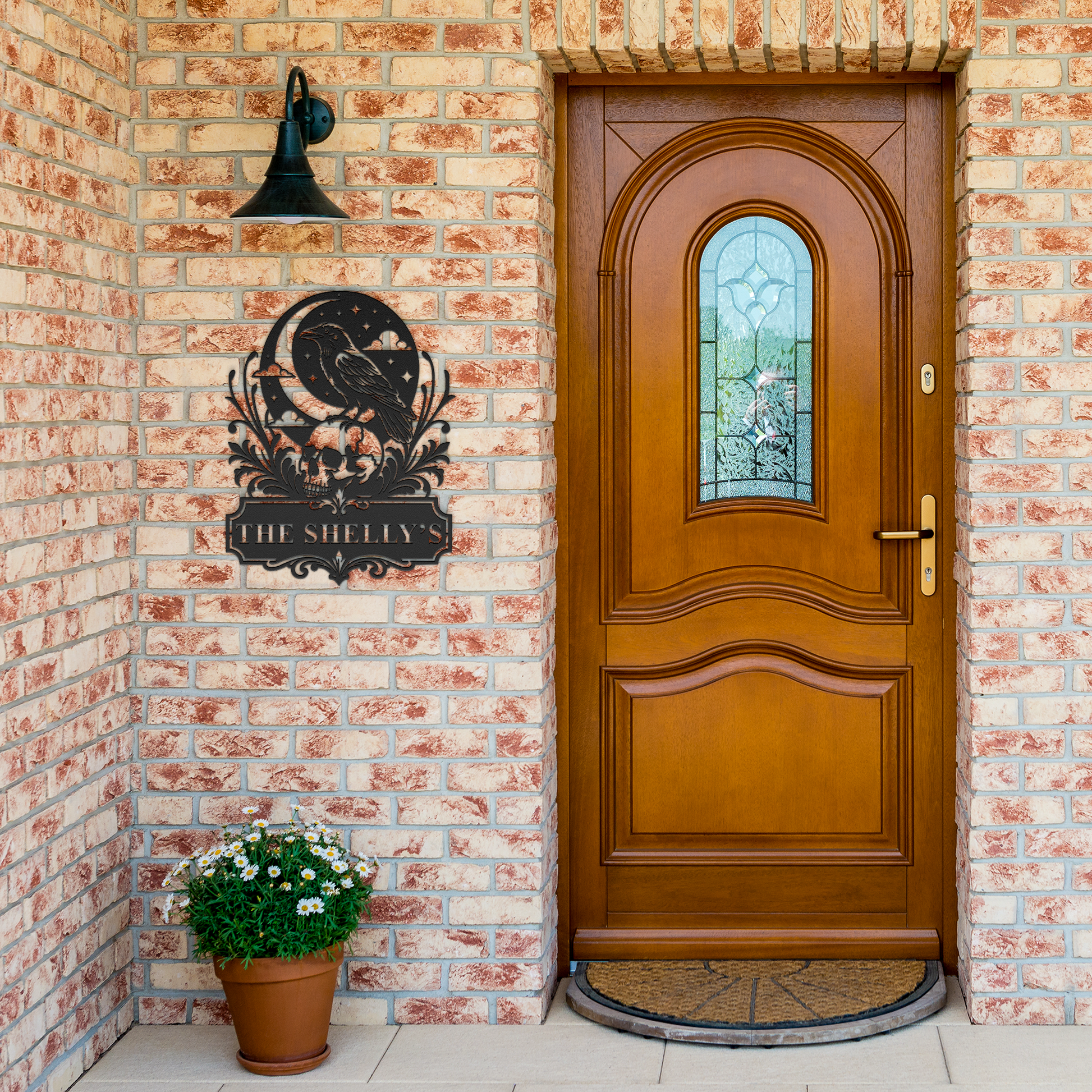 Black custom Halloween raven skull metal sign by brick entrance — personalized gothic porch decor