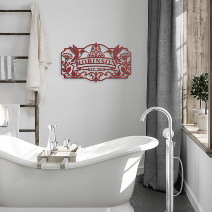 Red hummingbird family name metal sign in modern bathroom — personalized family name decor