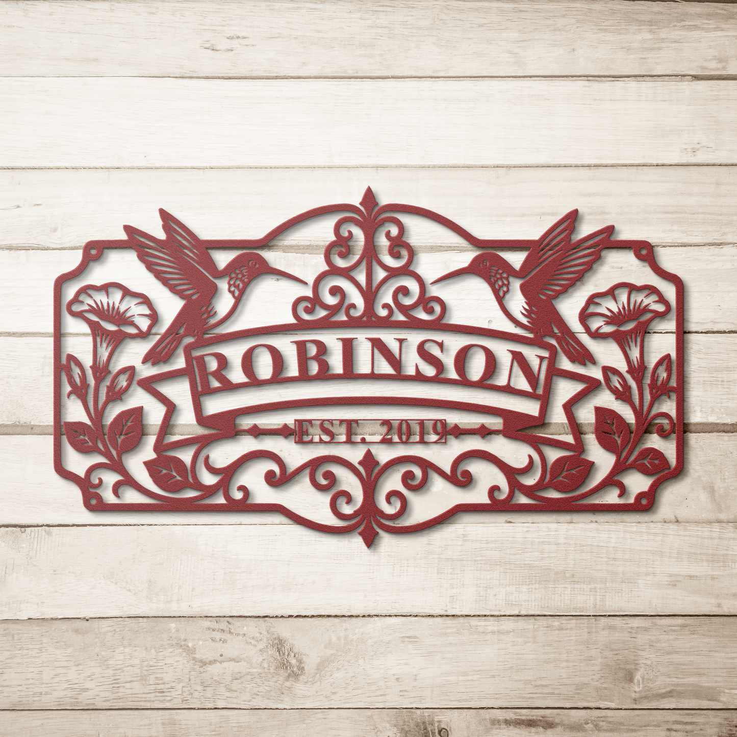 Red hummingbird family name metal sign on wood background — personalized wall art