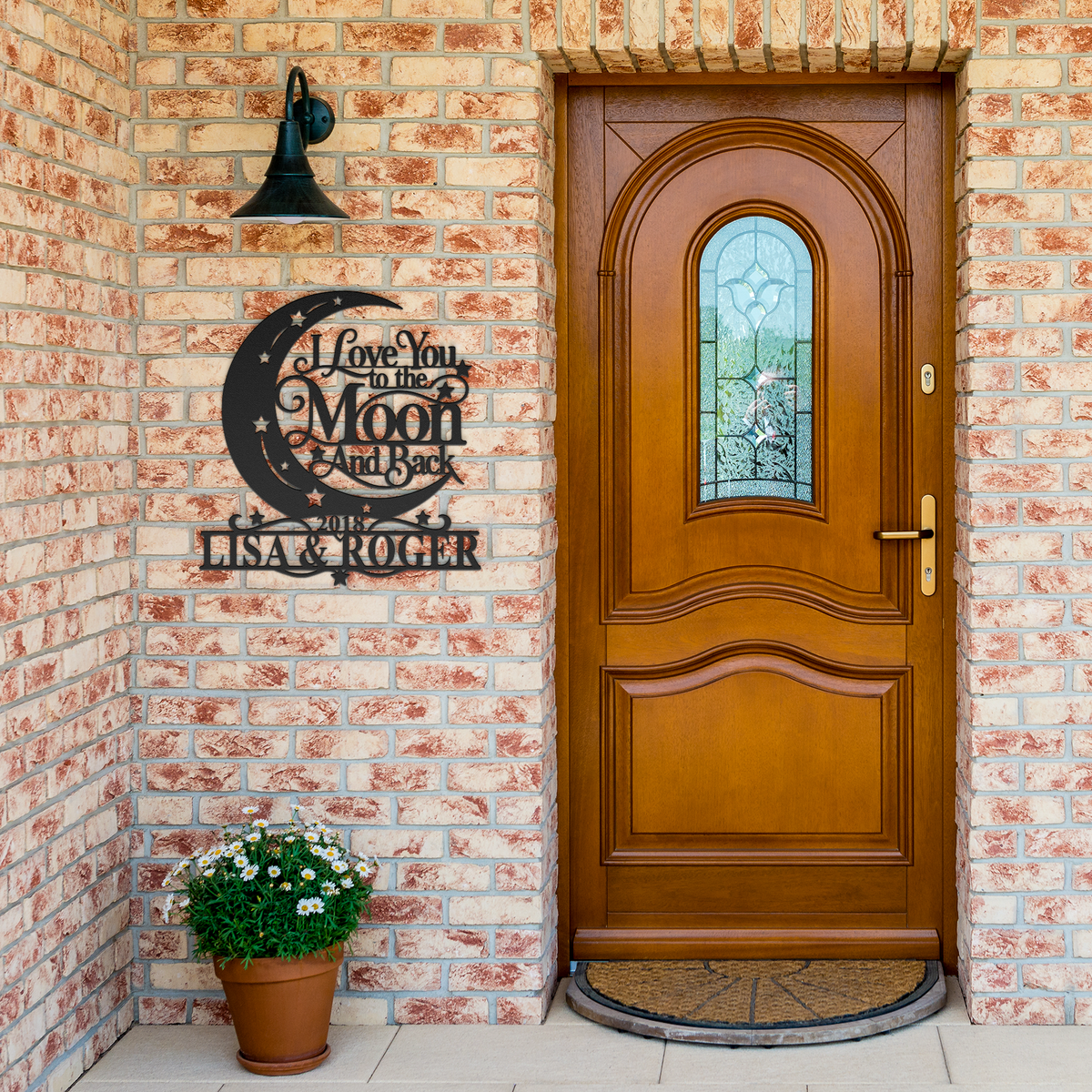 Black custom moon and back couples metal sign by brick entrance — personalized couples decor