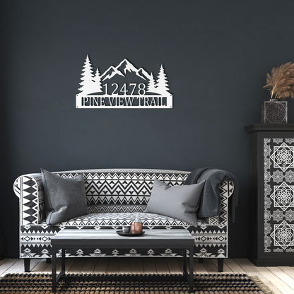 White custom mountain pine tree address metal sign in living room — personalized house number wall decor