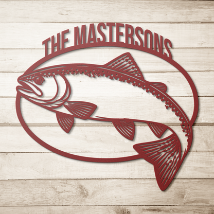 Red custom trout fishing metal sign on a wood background — personalized angler wall decor