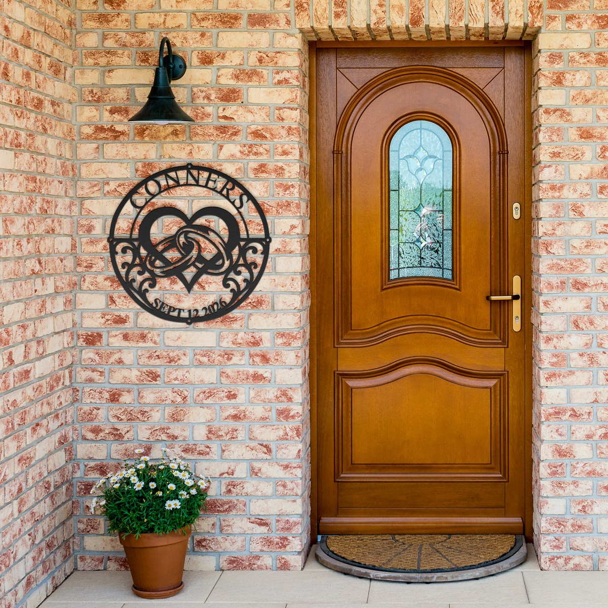 Black custom wedding heart rings metal sign by brick entrance — personalized couples decor