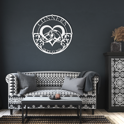 White custom wedding heart rings metal sign in a living room — personalized couples wall decor