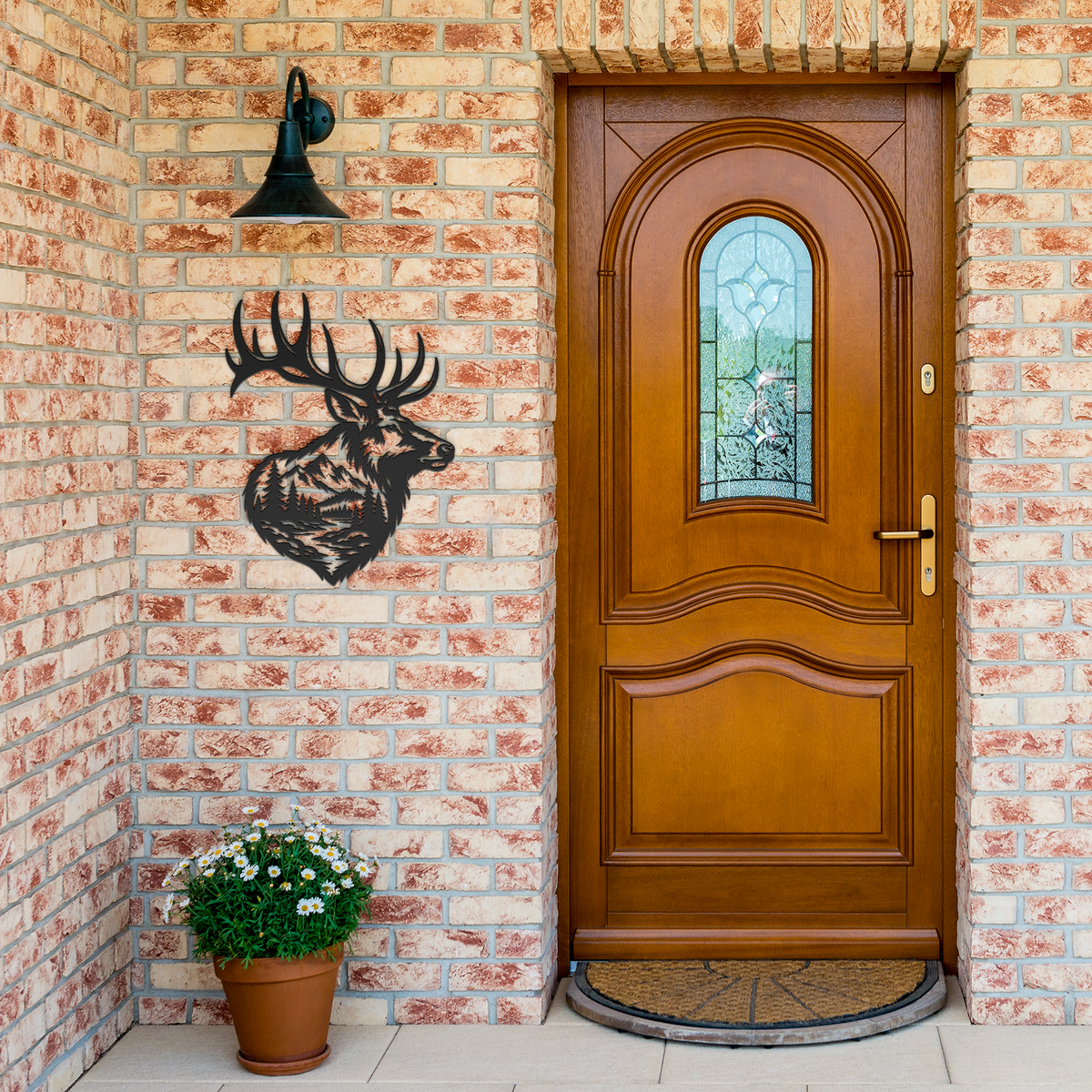 Black bull elk mountain metal wall art by brick entrance — steel wall decor