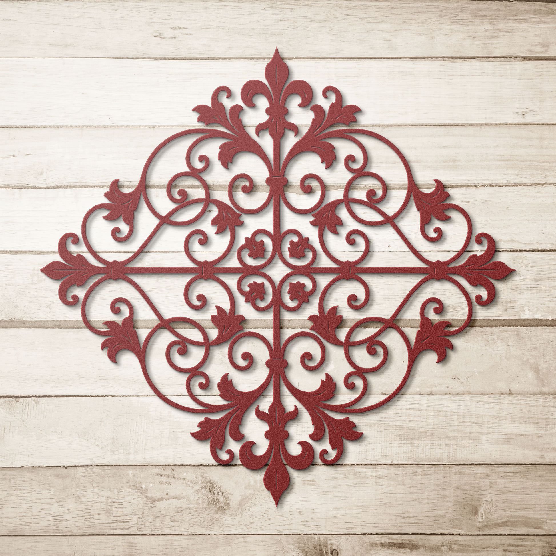 Red fleur de lis scrollwork metal wall art on a wood background — steel wall decor