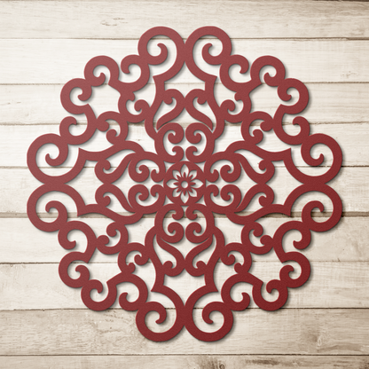 Red ornate scrollwork mandala metal wall art on a wood background — steel wall decor