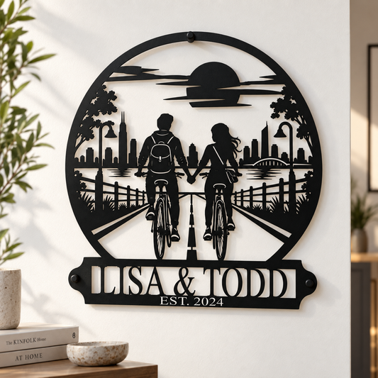 Custom cycling couple sign — personalized names, bike ride and city skyline in plasma-cut steel